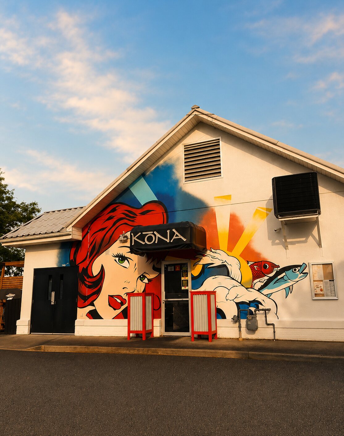 Kōna LaSalle's front entrance at golden hour — the pop-art mural wall under the KŌNA awning, warm evening sky.