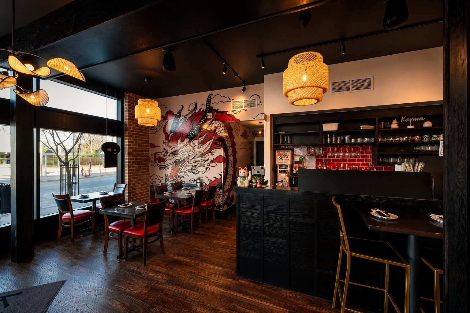 The Walkerville dining room — a fierce red-and-black dragon mural on a white wall beside the dark bar, rattan pendant lights, red-cushioned chairs and street-facing windows.